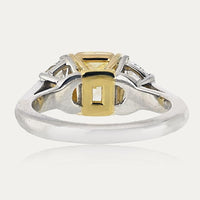 Platinum and 18K Yellow Gold 3-Stone Ring with 2.16 Carats GIA Certified Fancy Intense Yellow Radiant Cut Diamond and Diamond Shields - 0.97 Carats Total Diamond Weight