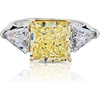 Platinum and 18K Yellow Gold Three-Stone Engagement Ring with 5.08 Carats Fancy Intense Yellow Radiant Cut Diamond and 1.31 Carats Kite-Cut White Diamonds