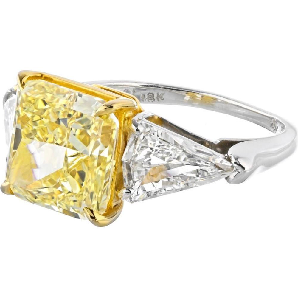 Platinum and 18K Yellow Gold Three-Stone Engagement Ring with 5.08 Carats Fancy Intense Yellow Radiant Cut Diamond and 1.31 Carats Kite-Cut White Diamonds