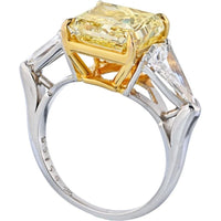 Platinum and 18K Yellow Gold Three-Stone Engagement Ring with 5.08 Carats Fancy Intense Yellow Radiant Cut Diamond and 1.31 Carats Kite-Cut White Diamonds