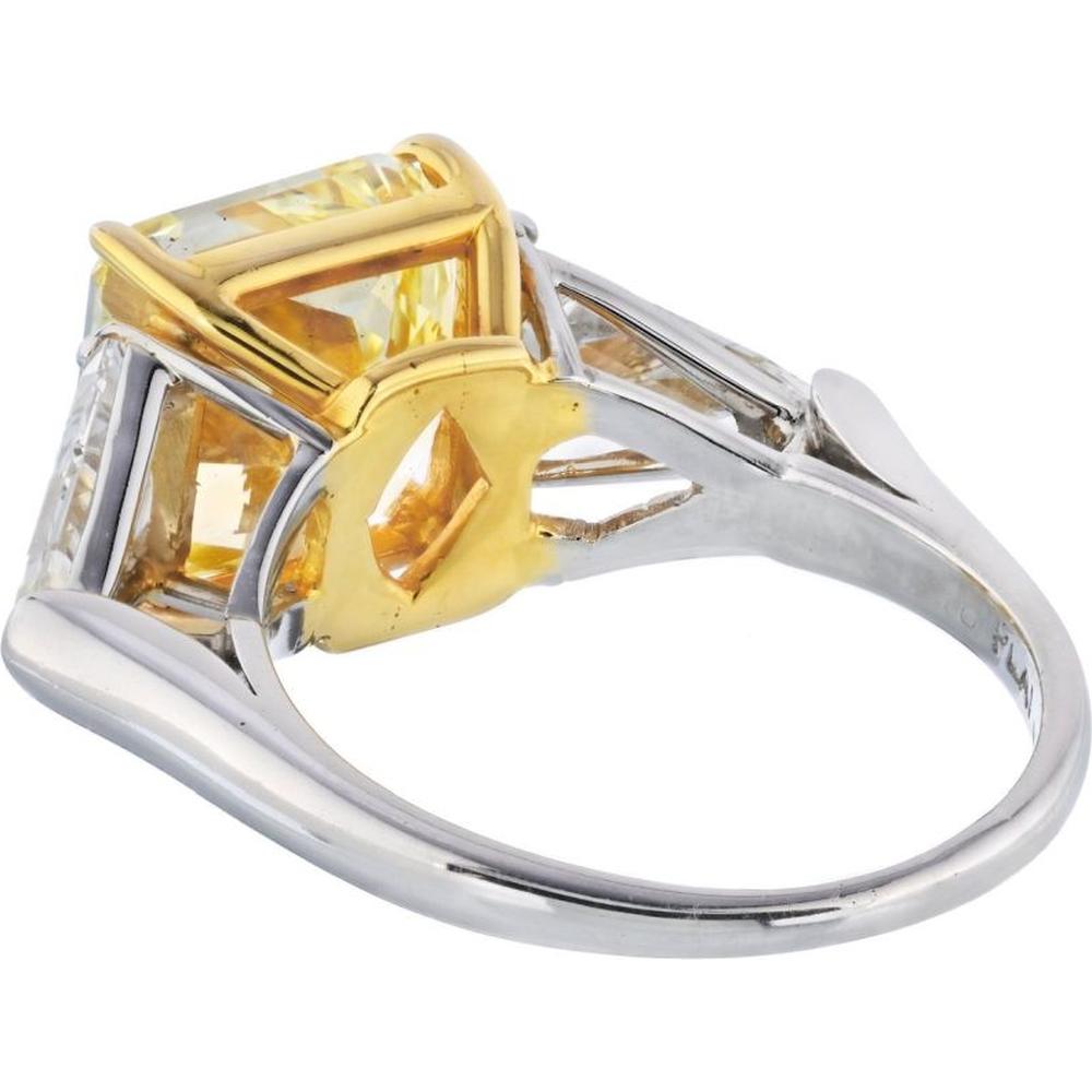 Platinum and 18K Yellow Gold Three-Stone Engagement Ring with 5.08 Carats Fancy Intense Yellow Radiant Cut Diamond and 1.31 Carats Kite-Cut White Diamonds