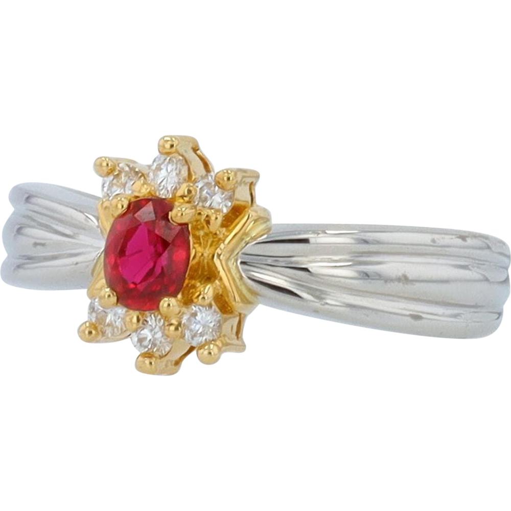 Platinum and Yellow Gold Halo Ring with 0.32 Carat Ruby and 0.12 Carat Diamonds