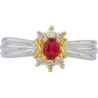 Platinum and Yellow Gold Halo Ring with 0.32 Carat Ruby and 0.12 Carat Diamonds