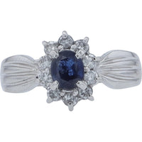 Platinum Halo Ring with Oval Blue Sapphire and Round Diamonds - 0.57 Carat Sapphire and 0.31 Carat Diamond Weight