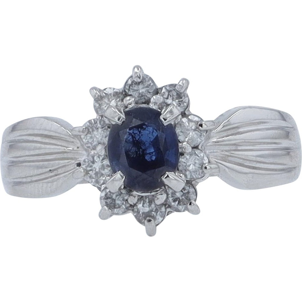 Platinum Halo Ring with Oval Blue Sapphire and Round Diamonds - 0.57 Carat Sapphire and 0.31 Carat Diamond Weight