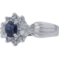 Platinum Halo Ring with Oval Blue Sapphire and Round Diamonds - 0.57 Carat Sapphire and 0.31 Carat Diamond Weight