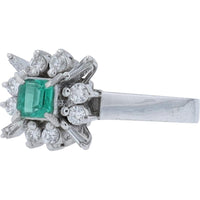Platinum Ring with 0.25 Carat Square Emerald and 0.24 Carats Total Diamond Weight