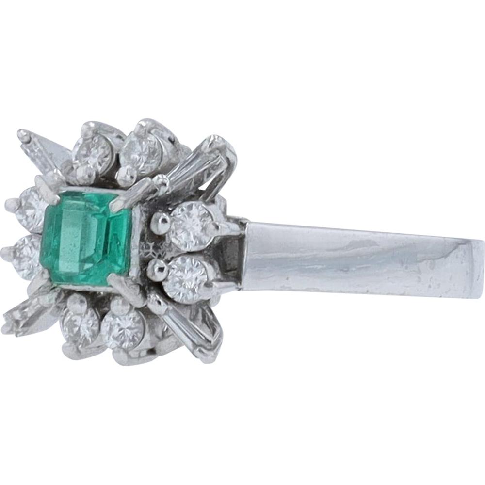 Platinum Ring with 0.25 Carat Square Emerald and 0.24 Carats Total Diamond Weight