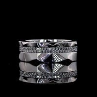 Platinum Special Eternity Band with 128 Faceted Sides and Black Rhodium Prong Set Round Lab-Grown Black VS2 Diamonds - 0.65 Carat Total Weight - Covaloro Fine Jewelry