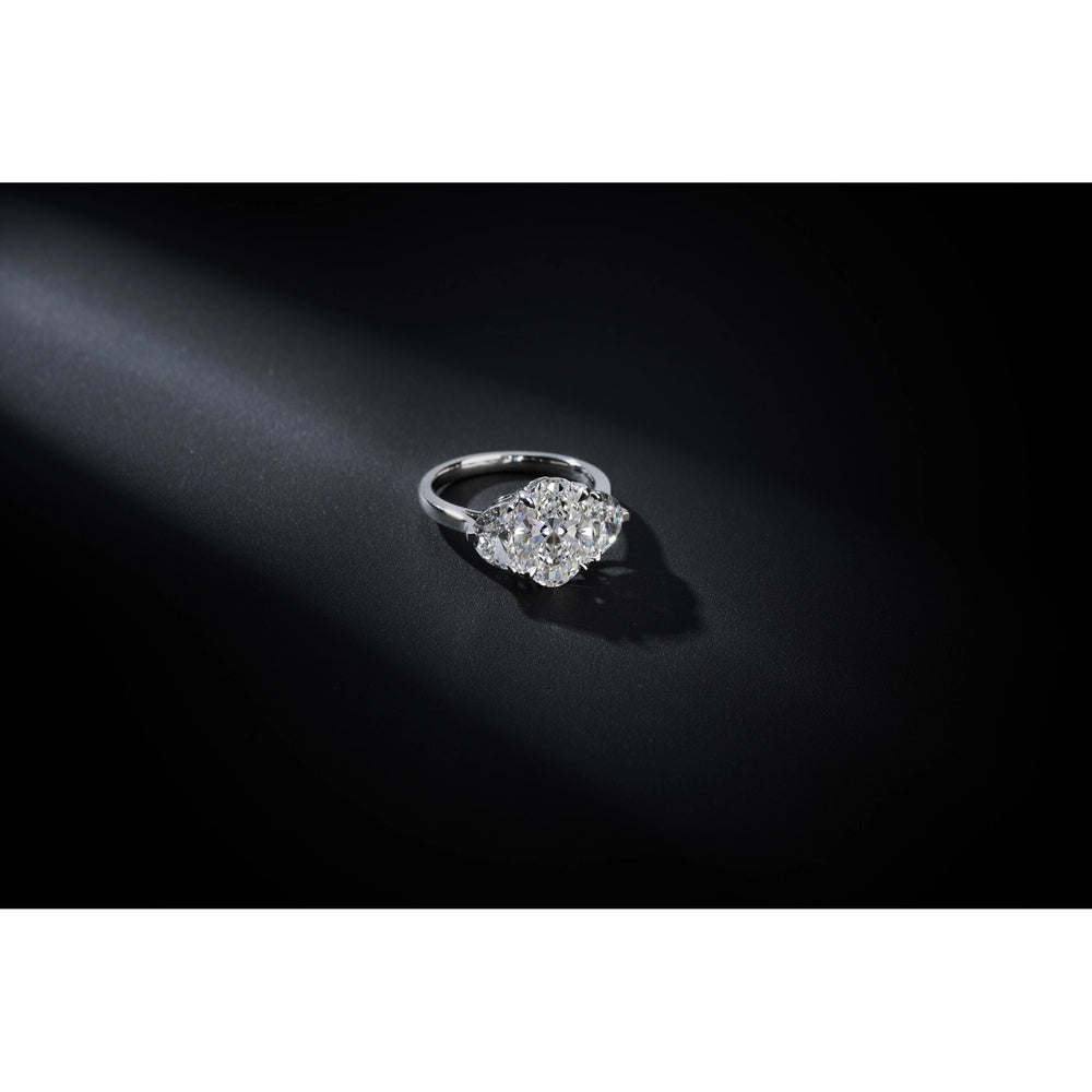 Platinum Three-Stone Ring with 2.09 Carat Oval Lab Diamond and 0.86 Carat Half-Moon Lab Diamonds - 2.95 Total Carat Weight - Covaloro Fine Jewelry