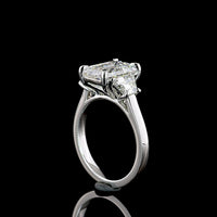 Platinum Three Stone Ring with 3.18 Carat Emerald Cut Lab Diamond and 1.07 Carat Trapezoid Cut Lab Diamonds - 4.25 Carat Total Weight - Covaloro Fine Jewelry