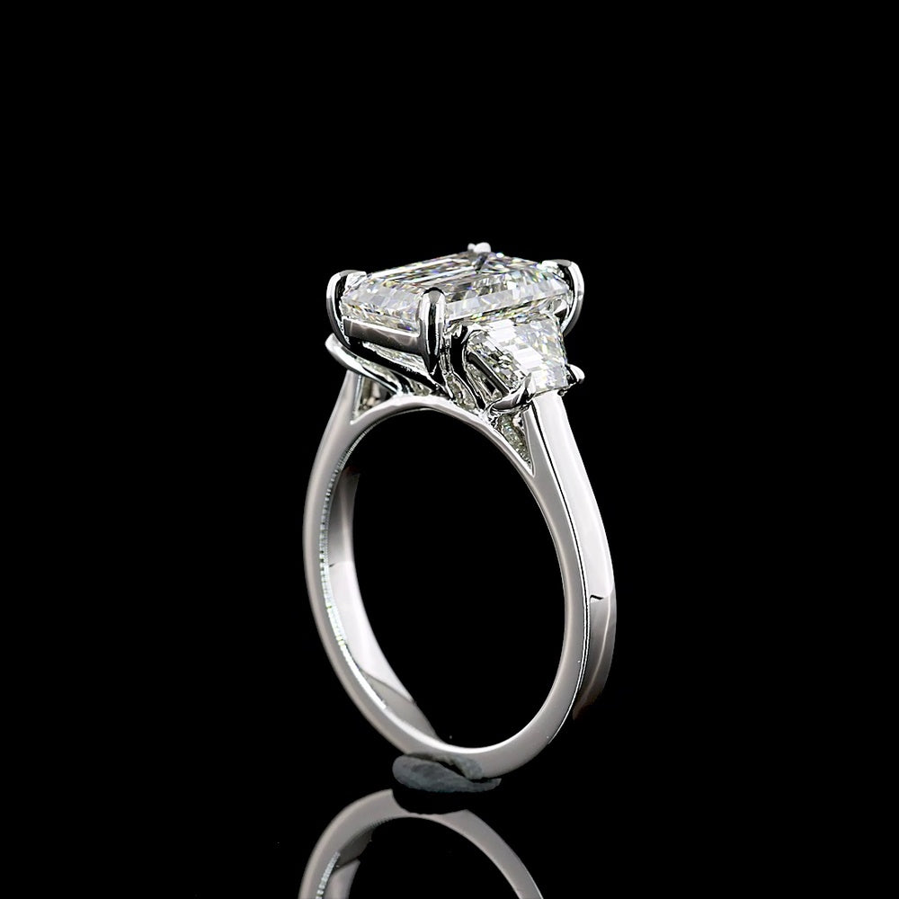 Platinum Three Stone Ring with 3.18 Carat Emerald Cut Lab Diamond and 1.07 Carat Trapezoid Cut Lab Diamonds - 4.25 Carat Total Weight - Covaloro Fine Jewelry