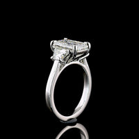 Platinum Three Stone Ring with 3.18 Carat Emerald Cut Lab Diamond and 1.07 Carat Trapezoid Cut Lab Diamonds - 4.25 Carat Total Weight - Covaloro Fine Jewelry