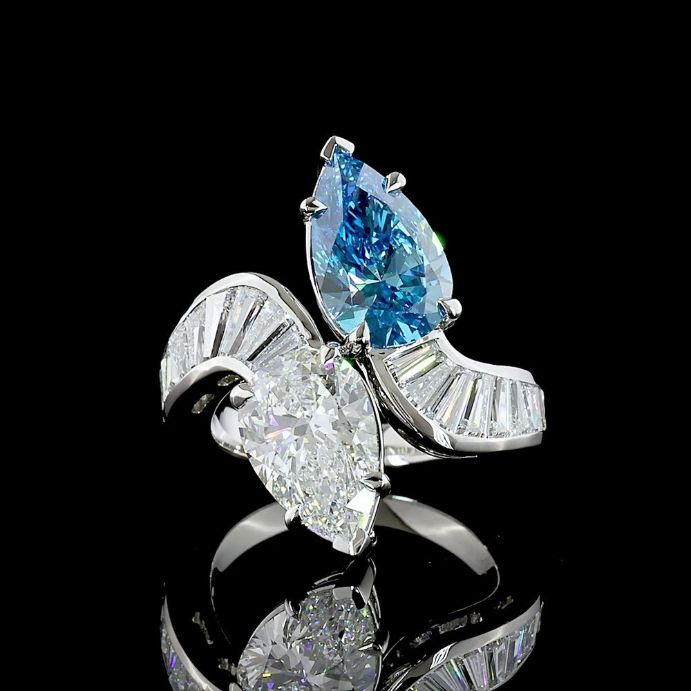 Platinum Toi et Moi Ring with Pear Shape Fancy Vivid Blue and White Lab Diamonds - 2.66 Carats Blue Diamond, 2.77 Carats White Diamond, Plus Baguette Accents - 7.09 Total Carat Weight - Covaloro Fine Jewelry