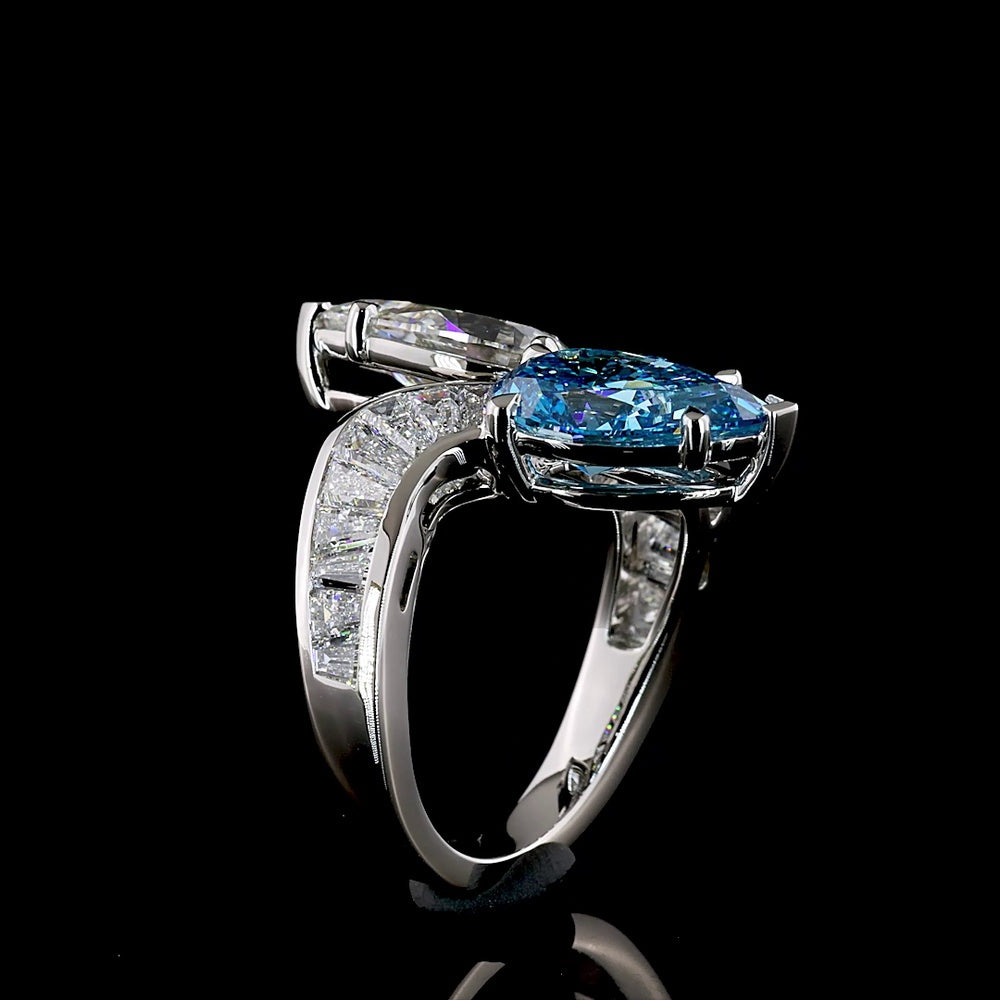 Platinum Toi et Moi Ring with Pear Shape Fancy Vivid Blue and White Lab Diamonds - 2.66 Carats Blue Diamond, 2.77 Carats White Diamond, Plus Baguette Accents - 7.09 Total Carat Weight - Covaloro Fine Jewelry