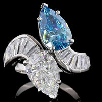 Platinum Toi et Moi Ring with Pear Shape Fancy Vivid Blue and White Lab Diamonds - 2.66 Carats Blue Diamond, 2.77 Carats White Diamond, Plus Baguette Accents - 7.09 Total Carat Weight - Covaloro Fine Jewelry