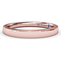 Polished Comfort Fit Wedding Band with Hidden Round Blue Sapphire Accent by Fana