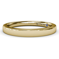 Polished Comfort Fit Wedding Band with Hidden Round Blue Sapphire Accent by Fana