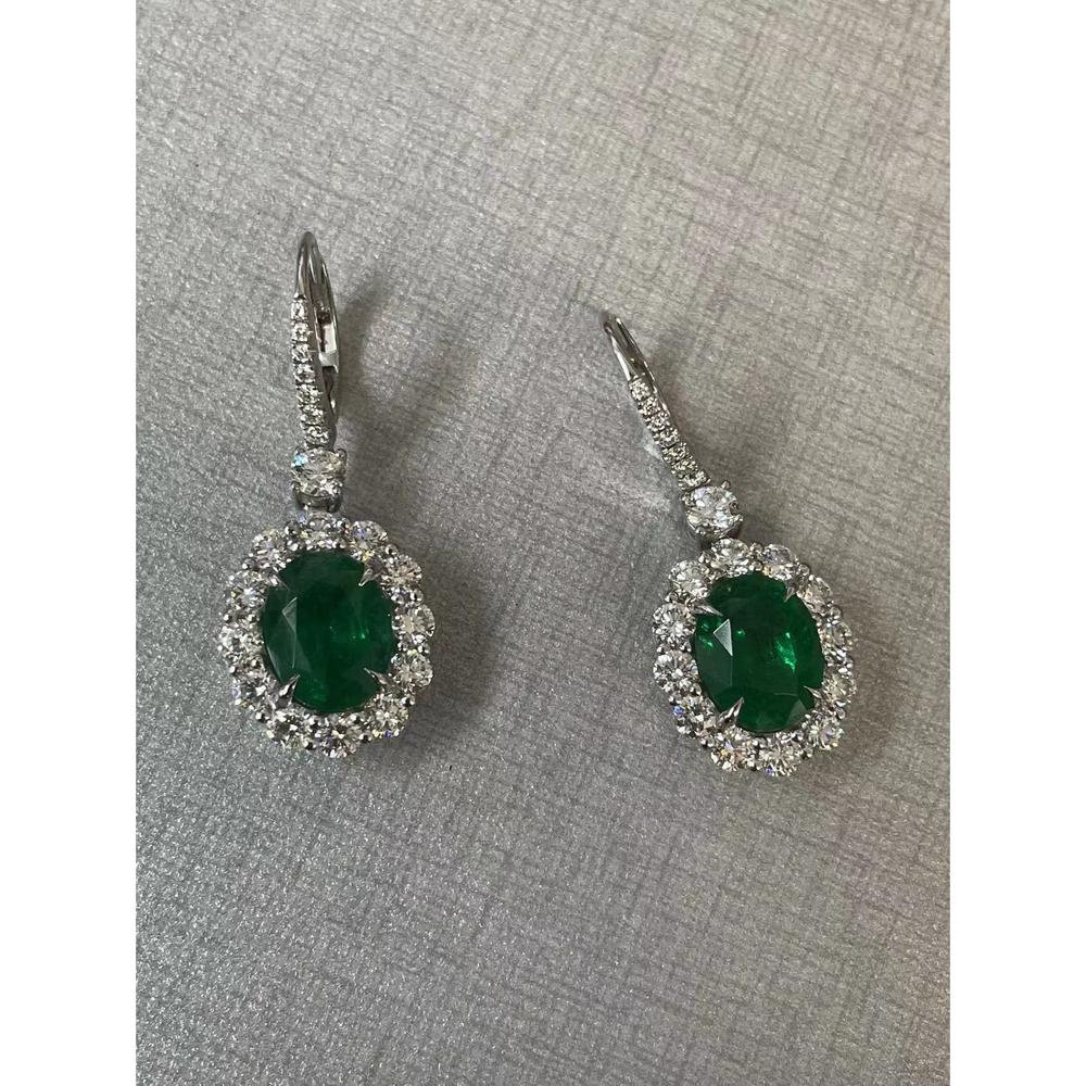 Roman & Jules - Platinum Oval Emerald and Diamond Halo Leverback Drop Earrings - 5.91 Carat Emerald and 3.12 Carat Total Diamond Weight