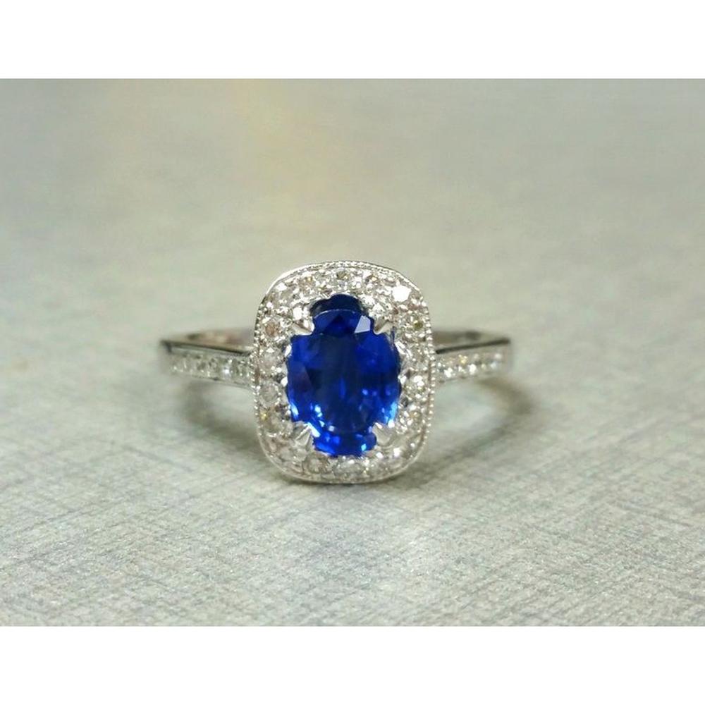 Roman & Jules - Platinum Oval Sapphire Ring with Diamond Halo featuring 1.11 Carat GIA-Certified Sapphire and 0.31 Carat Round Diamonds