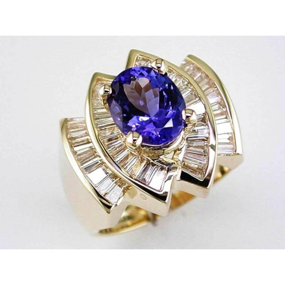 Royal 14K Yellow Gold Tanzanite and Baguette Diamond Halo Ring - 2.80 Carat Tanzanite, 1.40 Carat Diamond Total Weight