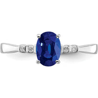 Sterling Silver Rhodium Plated Oval Sapphire Ring with Diamond Accents - 0.98 Carat Sapphire, 0.04 Carat Diamond by Lumare Gioia