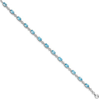 Sterling Silver Rhodium-Plated Tennis Bracelet with Oval Swiss Blue Topaz & Round White Topaz - 0.61 Carat Total Gem Weight by Monteluci Fine Jewelry