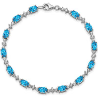 Sterling Silver Rhodium-Plated Tennis Bracelet with Oval Swiss Blue Topaz & Round White Topaz - 0.61 Carat Total Gem Weight by Monteluci Fine Jewelry