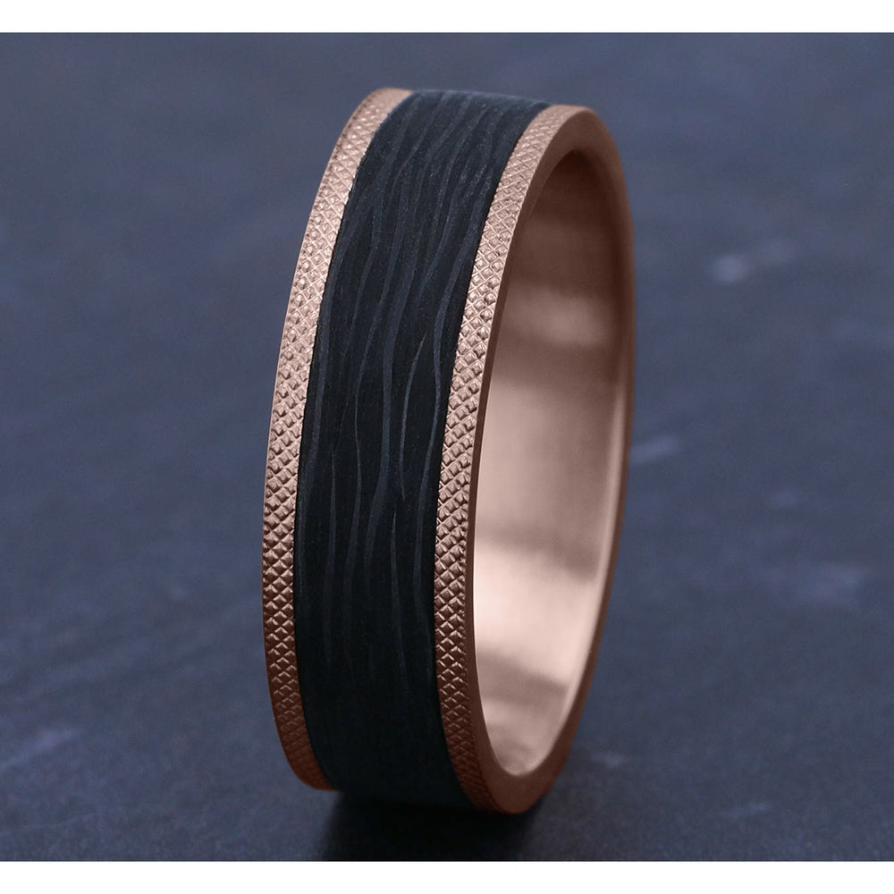 The Obsidian Men's Wedding Band in 14K Rose Gold and Forged Carbon Fiber - 7mm Width by Ammara Stone