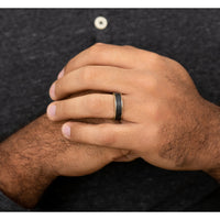 The Schumacher Men's Wedding Band in 14K Yellow Gold and Black Carbon Fiber - 6.5mm Width by Ammara Stone