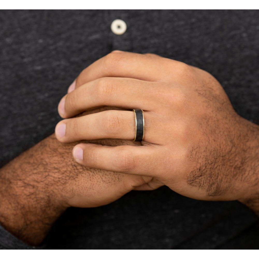 The Schumacher Men's Wedding Band in 14K Yellow Gold and Black Carbon Fiber - 6.5mm Width by Ammara Stone