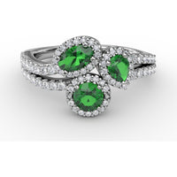 Three-Stone Oval Emerald Ring with Diamond Halos and Split Shank by Fana - 1.06 Carat Total Gemstone Weight