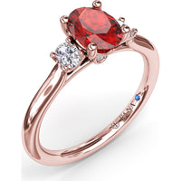 Three Stone Ring with Oval Ruby and Diamond Side Stones by Fana - 1.31 Carat Total Gemstone Weight